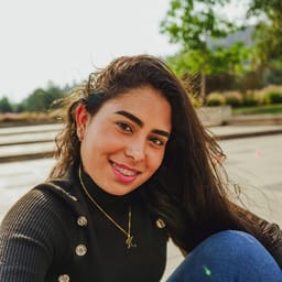 Cami T.